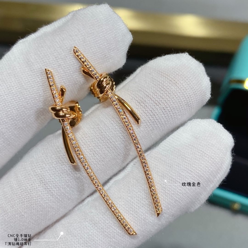 T*f*ny earrings